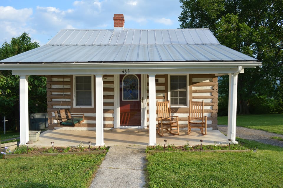 Front porch with rockers and porch swing.