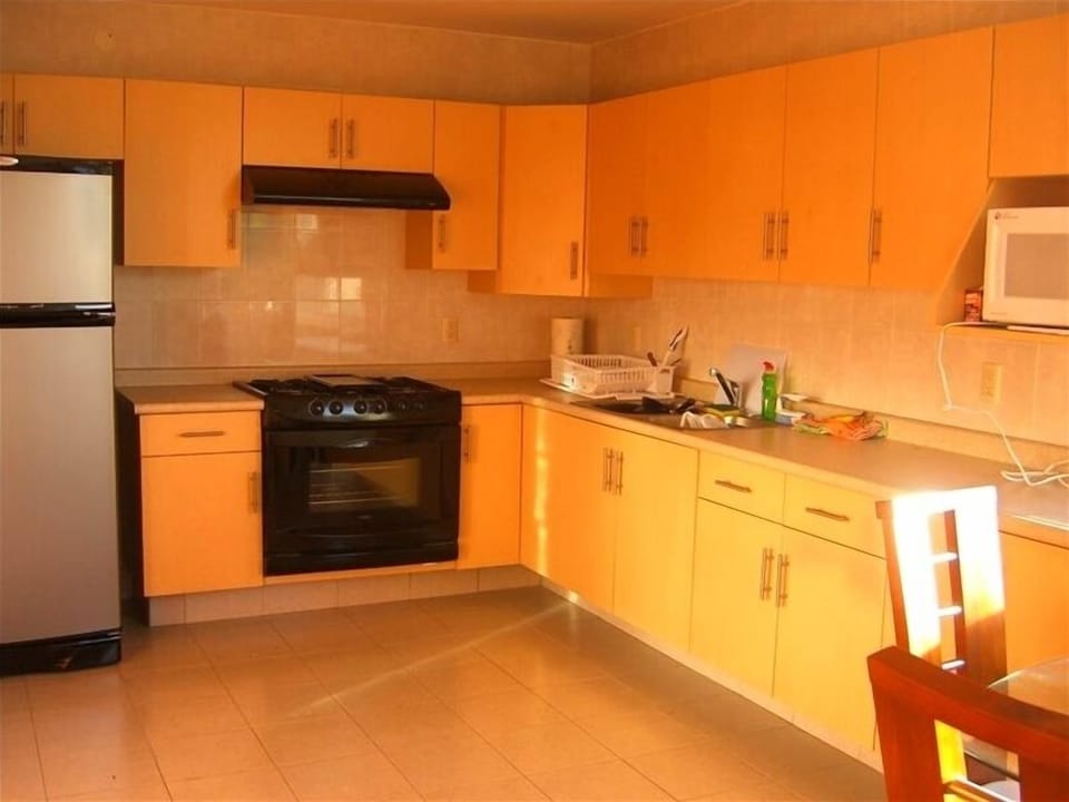 Large oversized kitchen with new fridge and micro