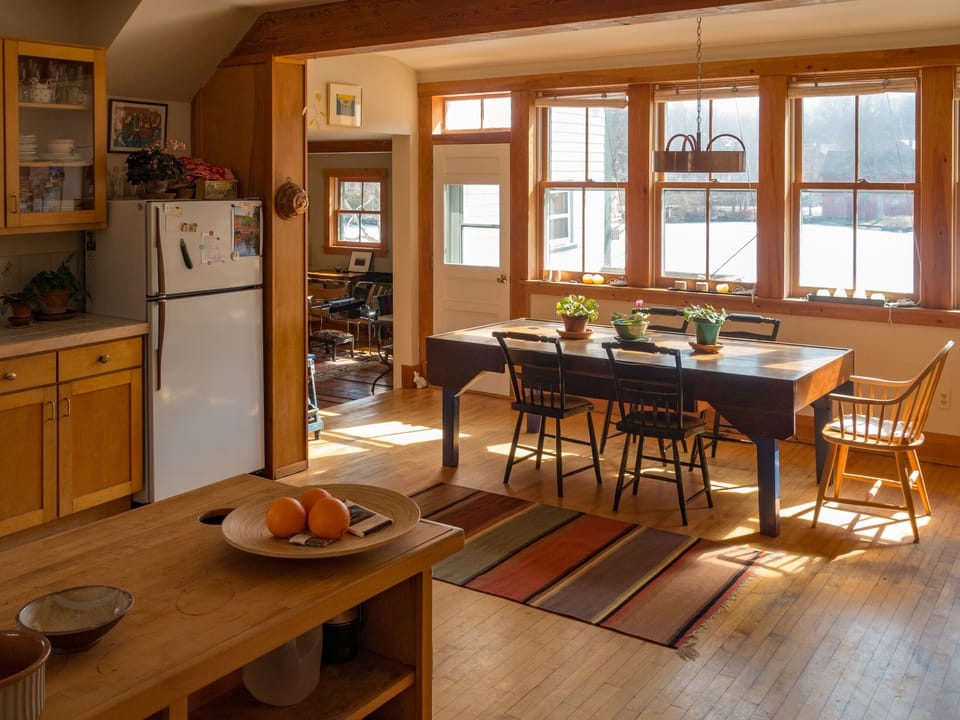 The light-filled dining area has a marvelous view of the lake and town