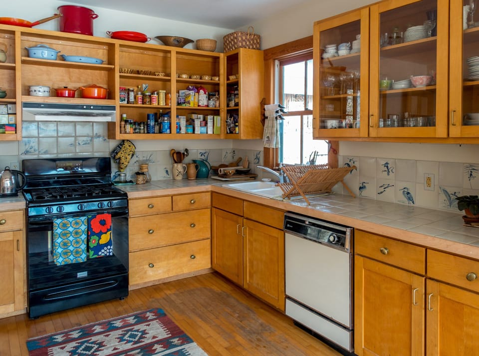 The spacious kitchen is perfect for cooking and gathering and has a lake view