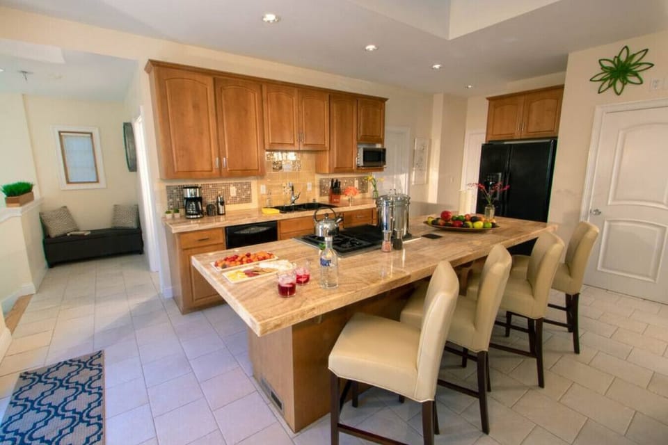 Main floor kitchen with oven, stove, dishwasher, and refrigerator