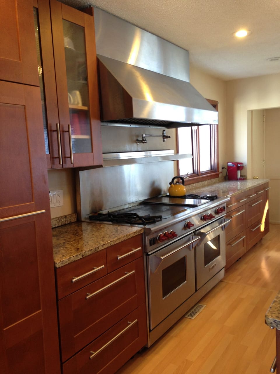 Cherry Cabinets and a dual fuel wolf stove.