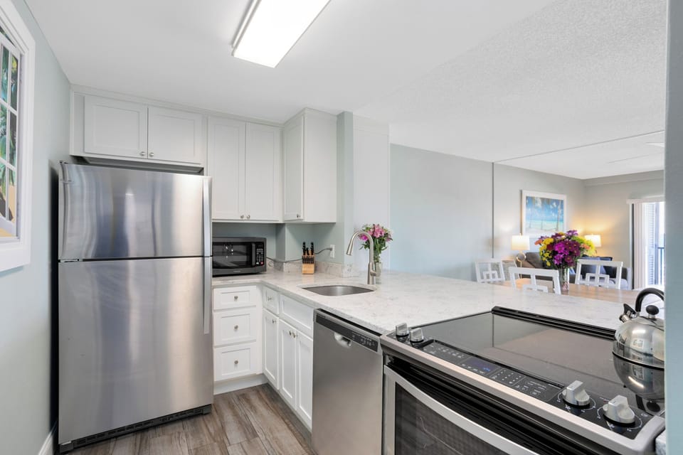 Modern and fully equipped kitchen with stainless steel appliances