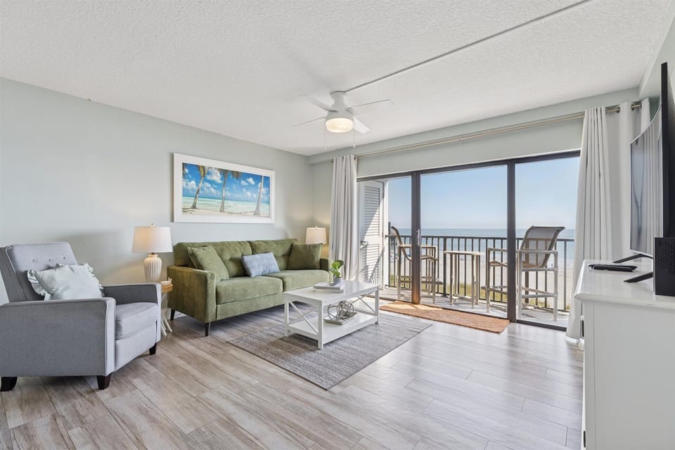 Bright and airy living space with stunning ocean views and cozy seating