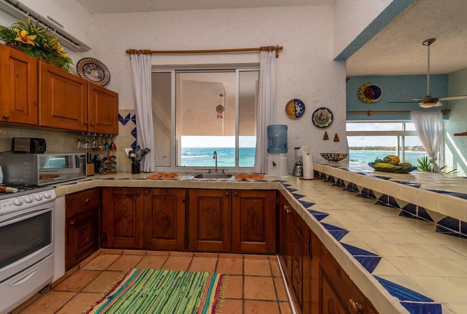 Kitchen with purified water provided - La Sirena condo 14 Akumal Mexico vacation rental 2 king bedrooms with 2 baths.