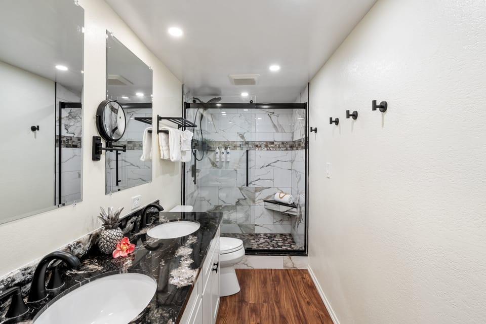 The remodeled bathroom offers generous counter space and contemporary finishes.