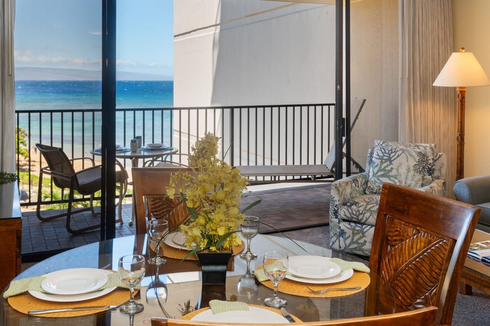 Bright dining space beside the lanai with scenic ocean and resort views.