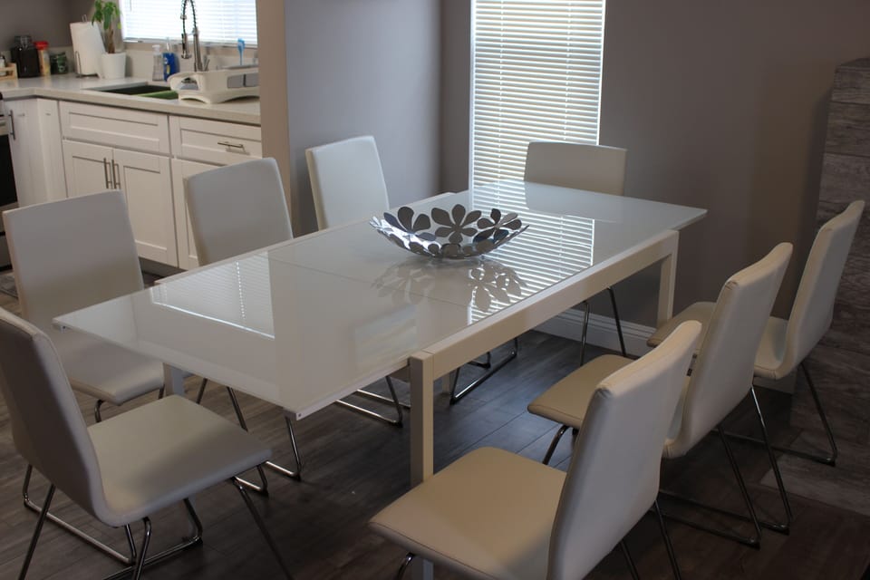 Table extended to larger size to fit 8 chairs.