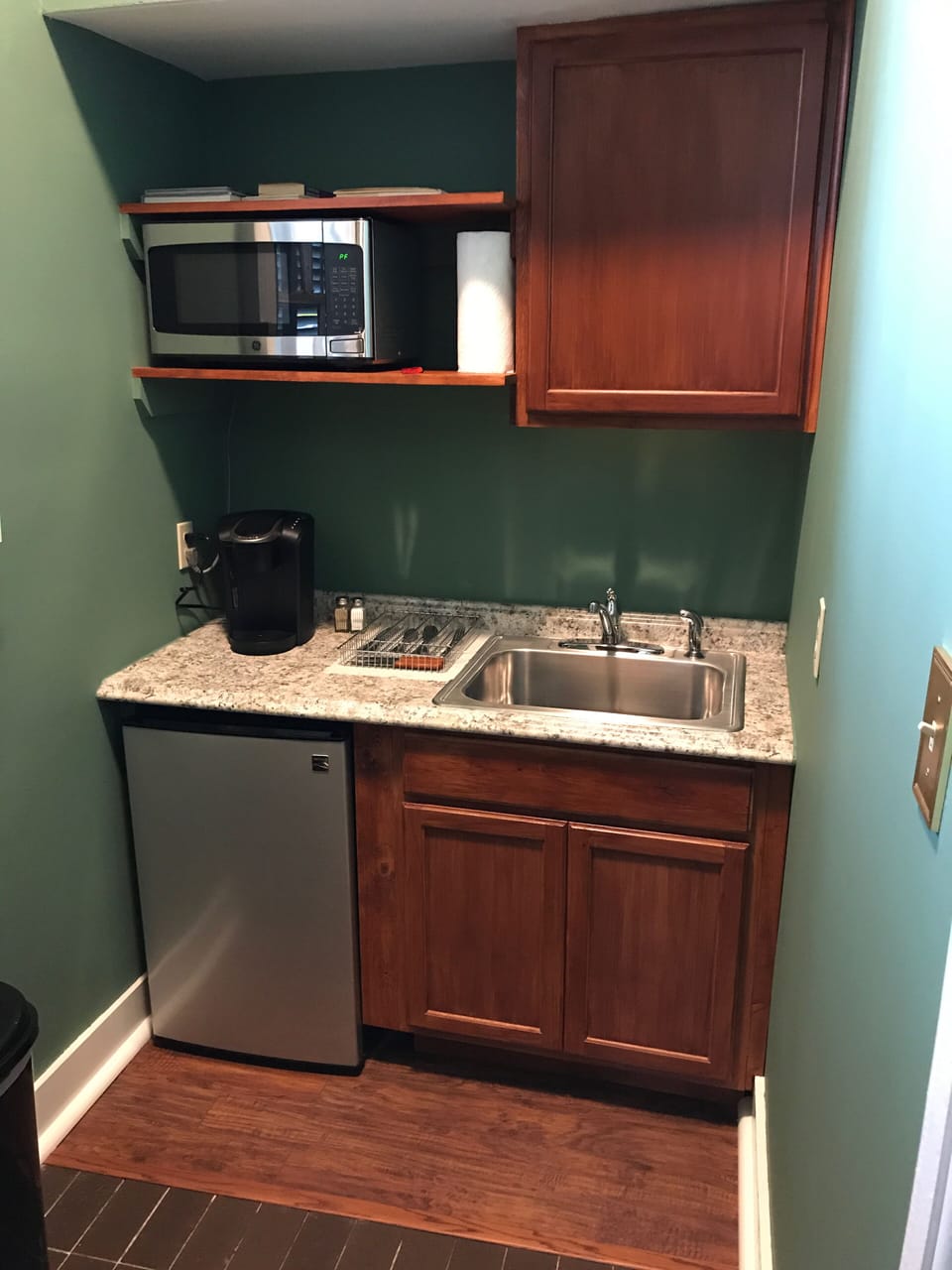 Kitchenette furnished w/fridge, microwave, utensils, dinnerware, Keurig, & Brita