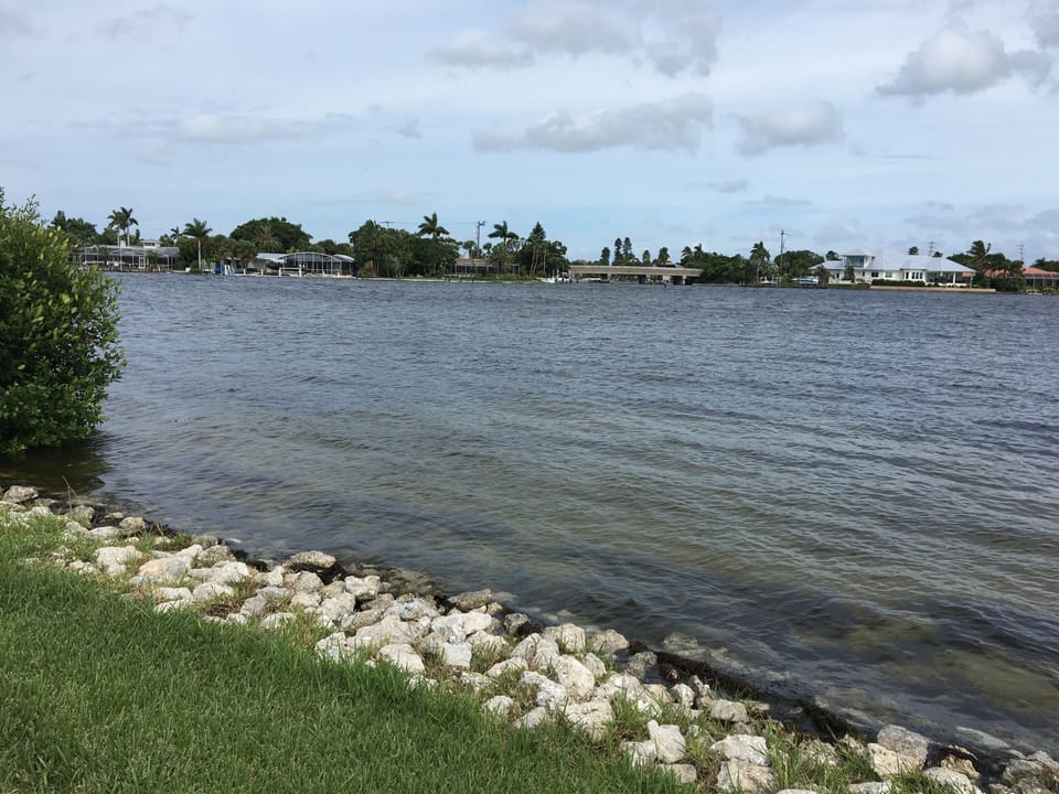 Relax next to the water on the property 