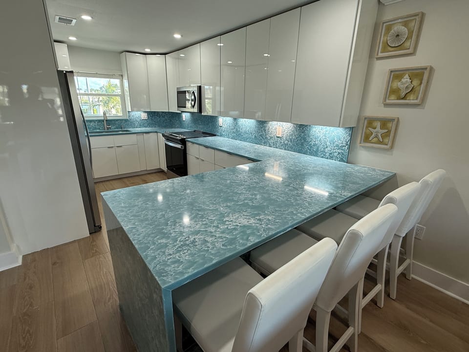 Beautiful, Large Kitchen with Quartz Counters and Sleek, Modern Cabinets