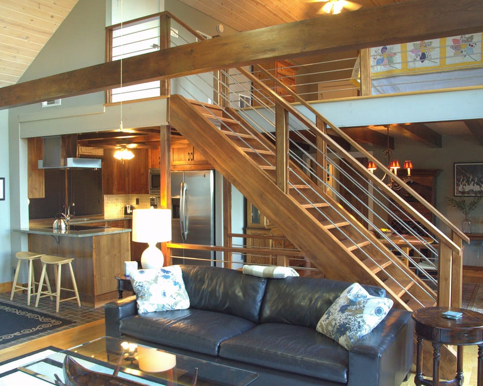 Looking back towards the kitchen and dining room with the stairs to the loft