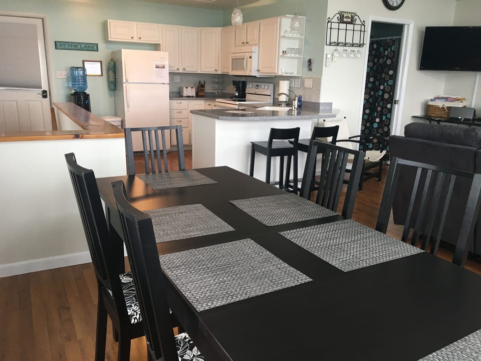 Easily can sit 8-10 at the dining room table and additional chairs provided