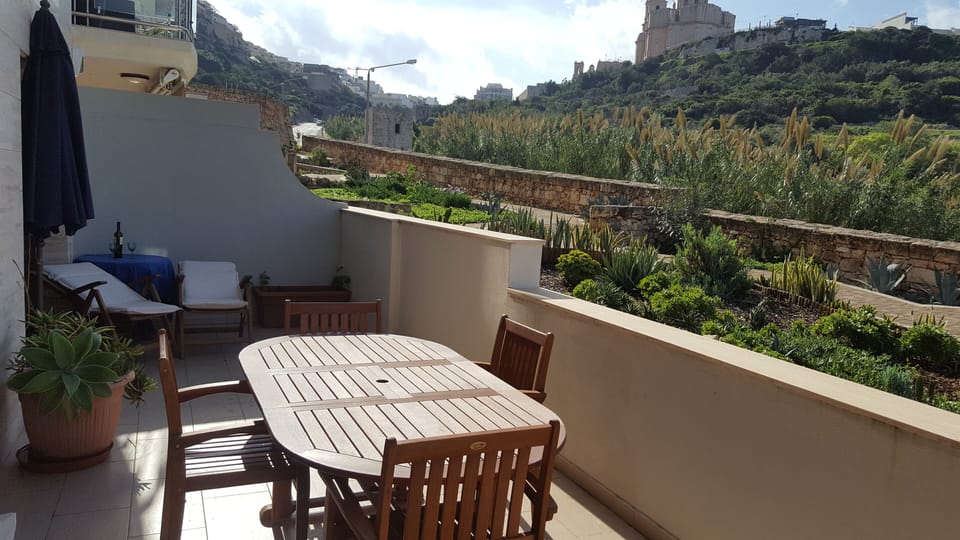 Terrace, deckchairs, outdoor dining with a view