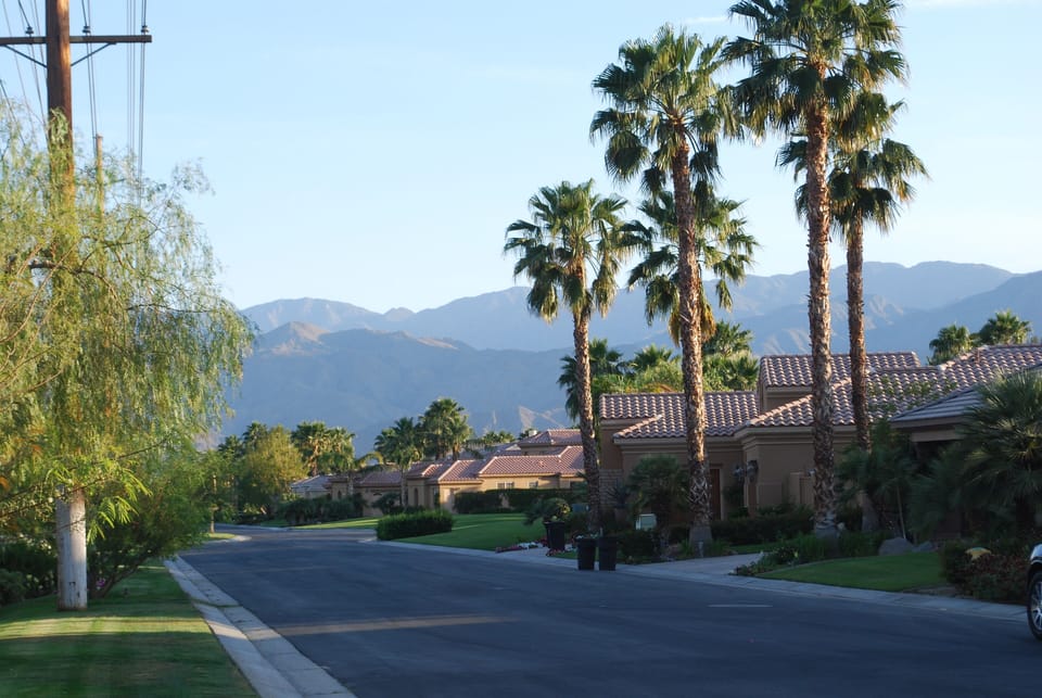 Neighborhood street view with mountain backdrop