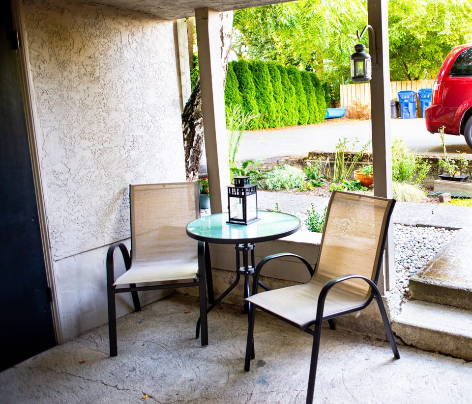 Small shared covered seating area outside where you can enjoy a coffee or meal,