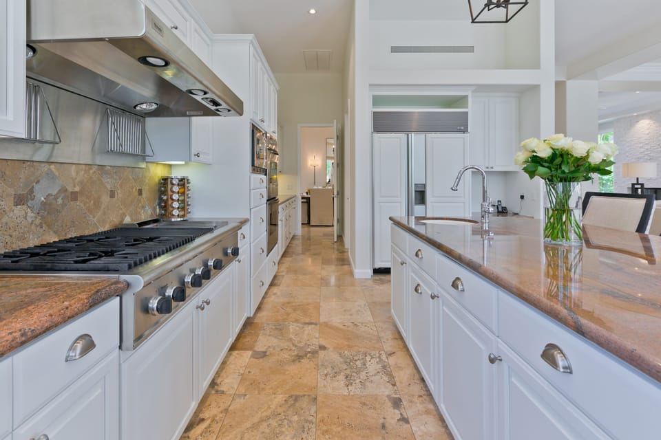 Walk in pantry, and butlers hallway. Includes Thermador six gas burner & grill.