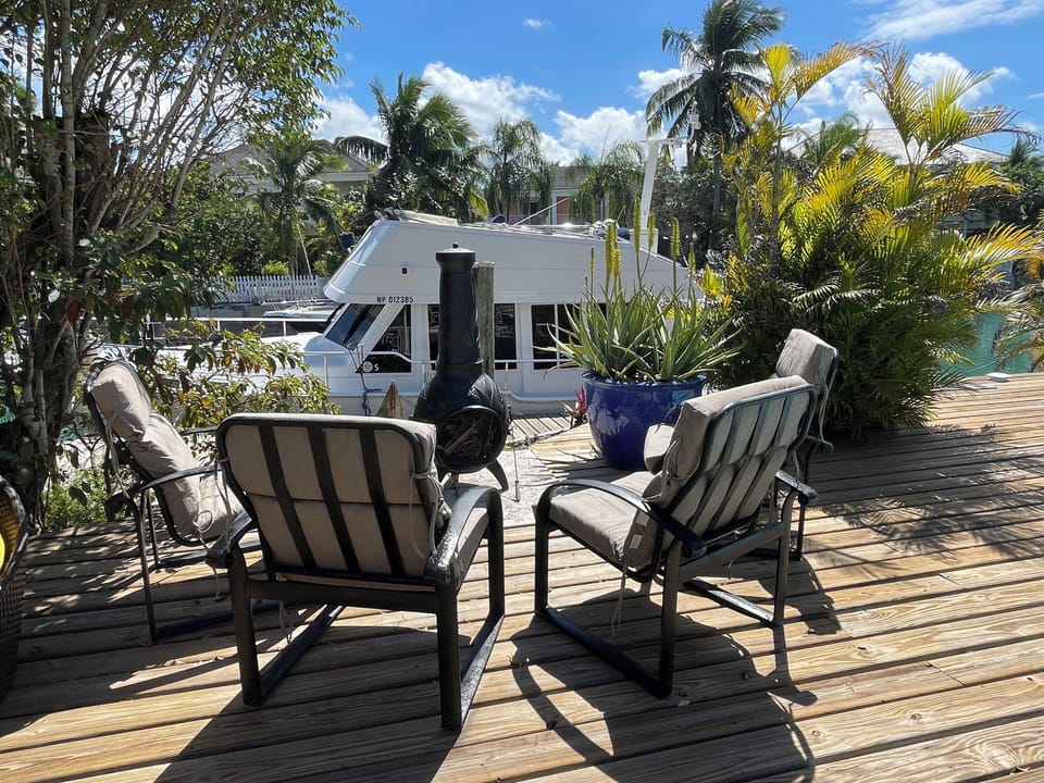 Relax, you're on island time now. Comfort in front of an outdoor fireplace.
