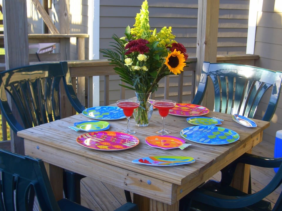 Groud Level Deck: Furnished with table and chairs for BBQ picnic.
