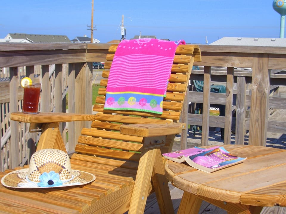 Top Deck: 2 King Adirondack chairs, Chaise Lounge, and a table.