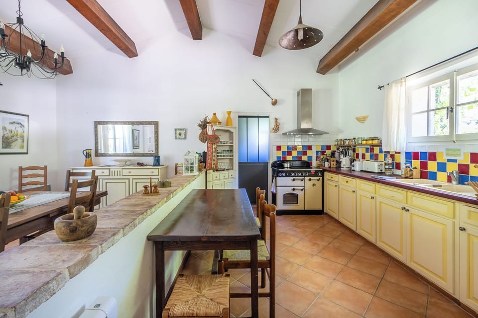 Kitchen with views of multi-function stove and entrance to further equipement