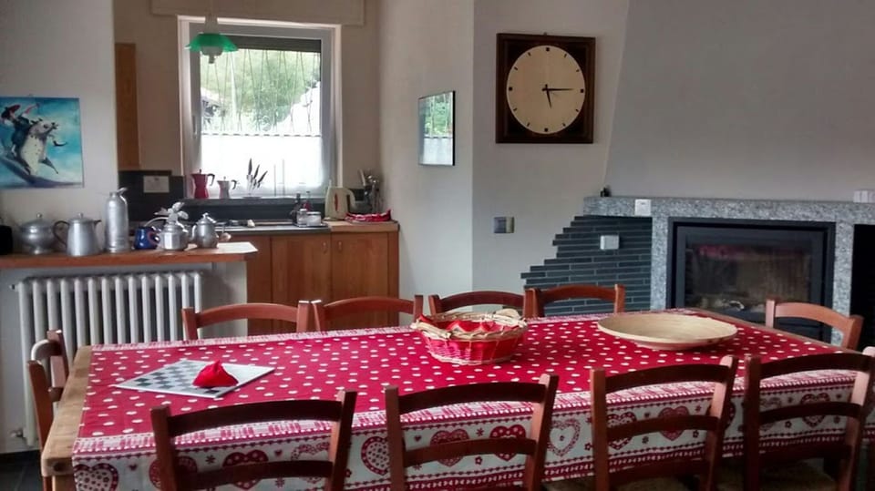 The big table in the living room with 12 seats