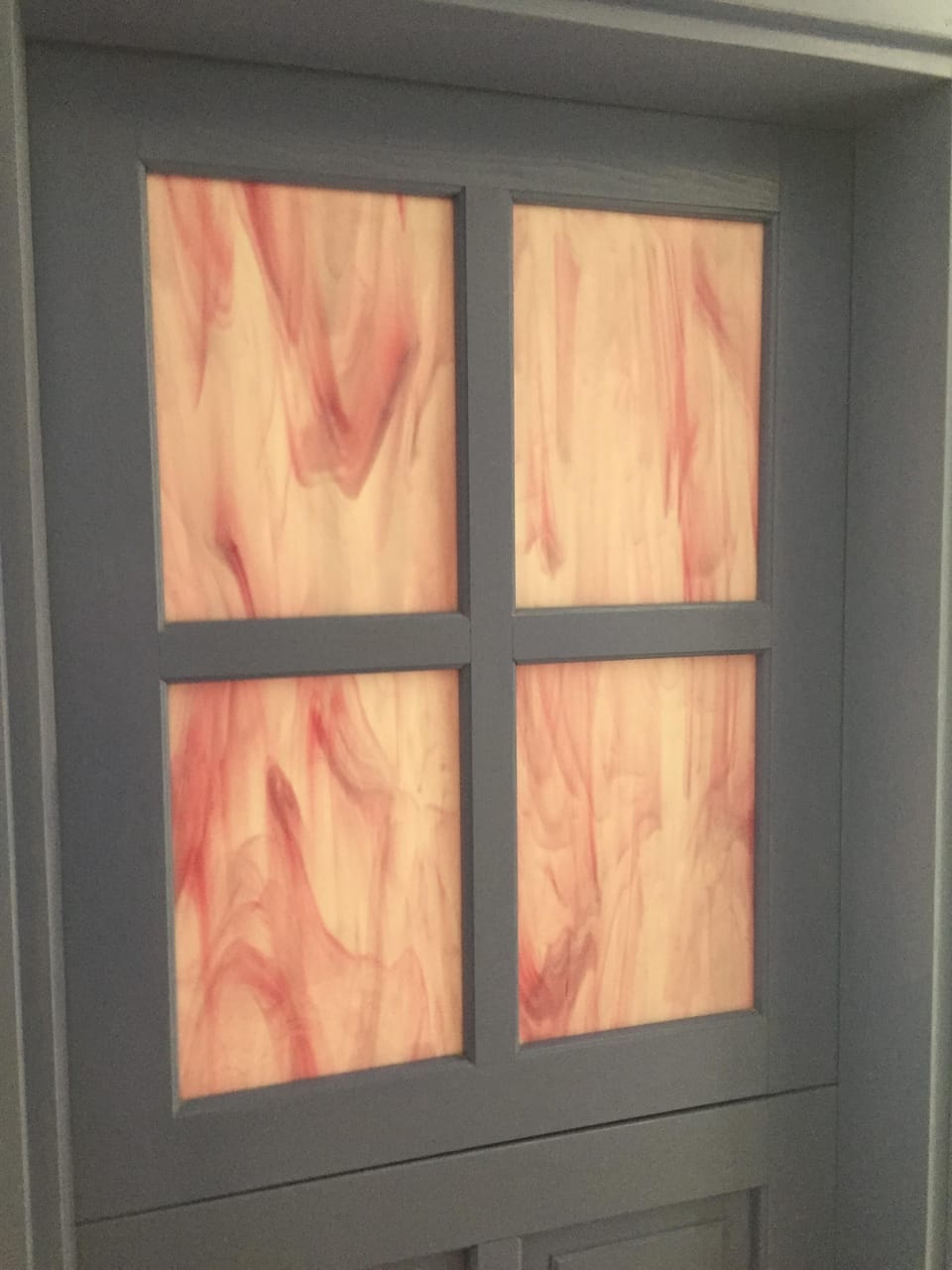 Hand-blown art glass in the door windows.