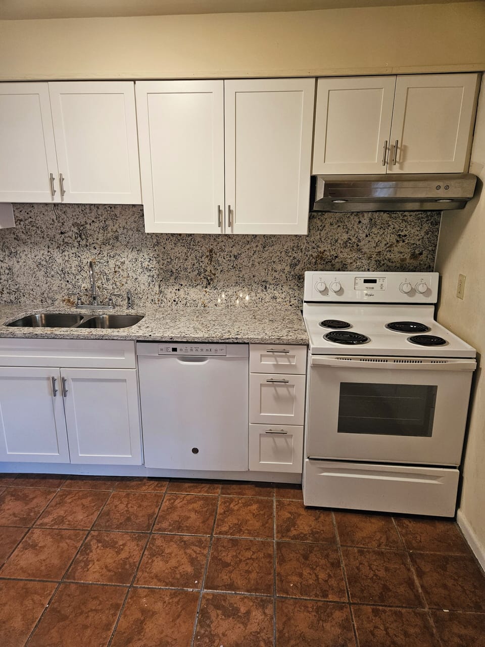 New kitchen with granite countertops and backsplash