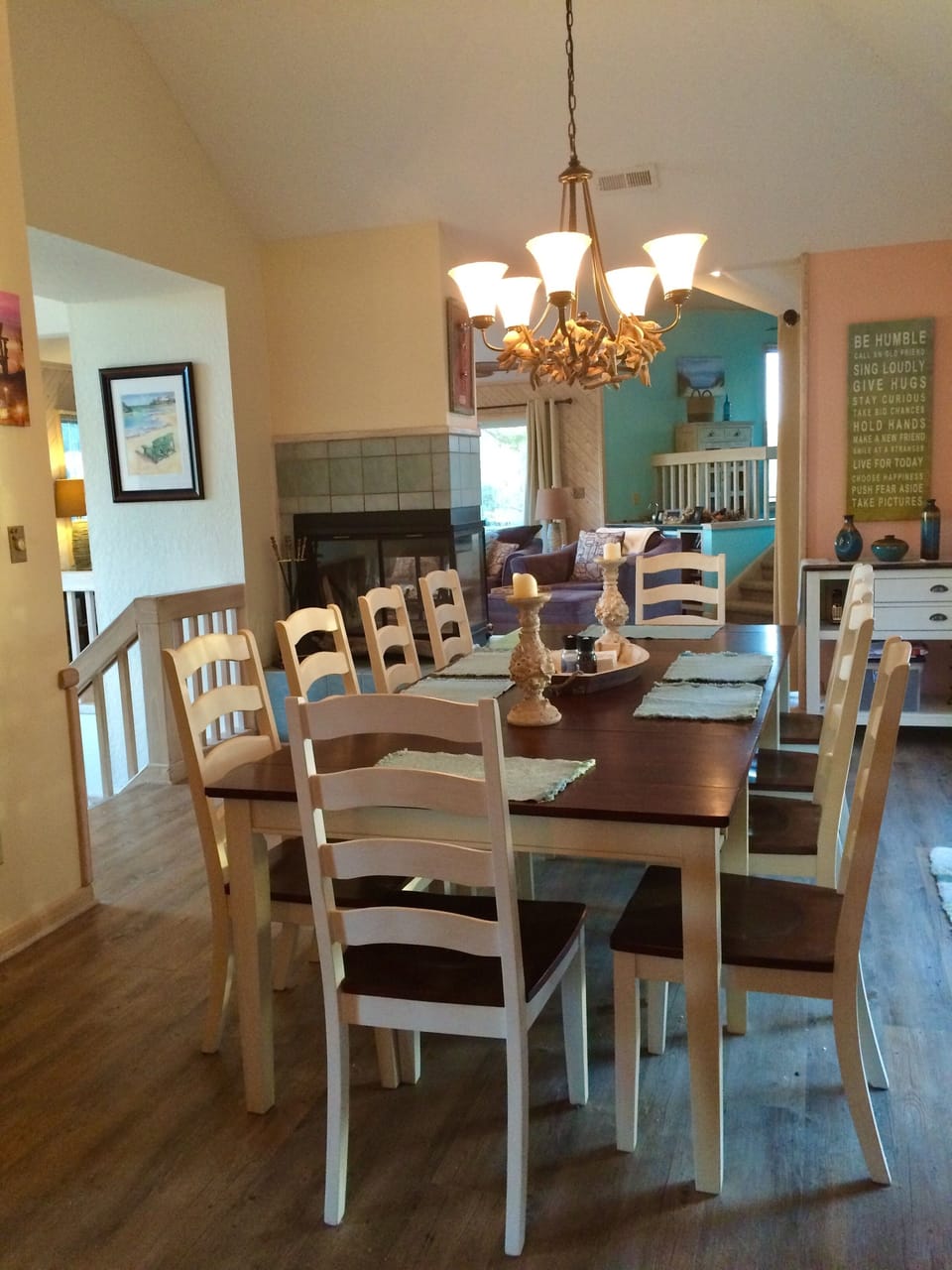 Dining area opens to triple slider with deck and screened porch