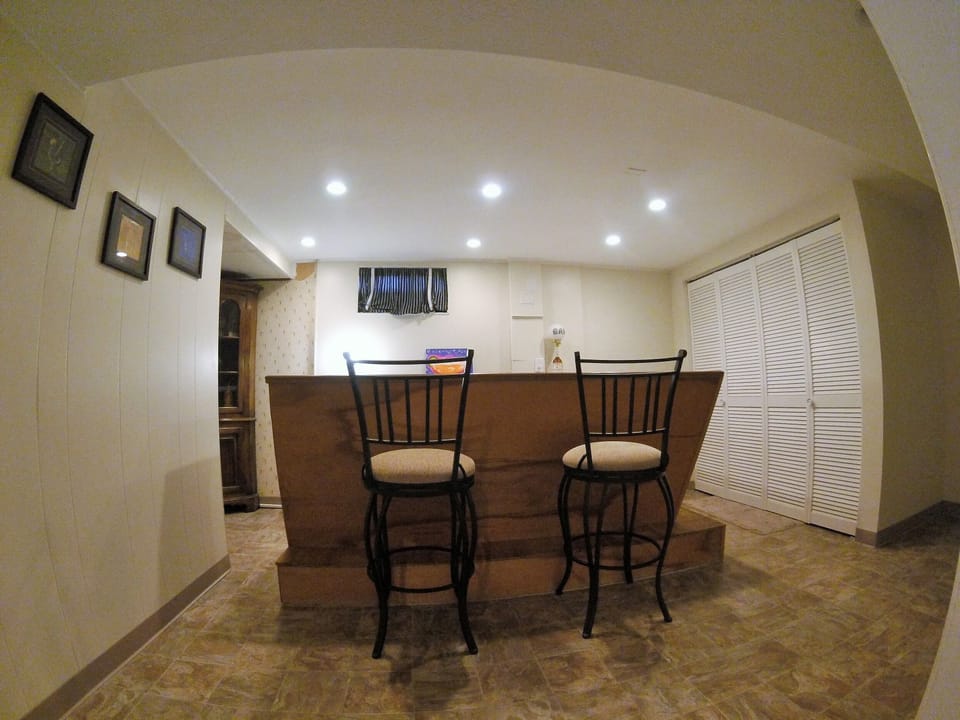 Bar area, with laundry behind sliding white doors.