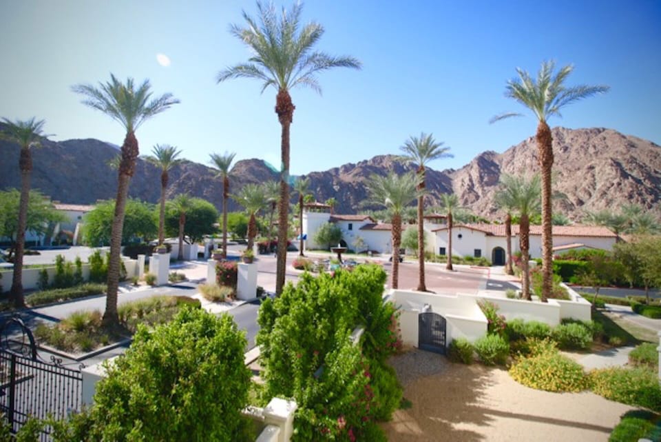 Side-view from main patio with view of Legacy Clubhouse and main pool areas.