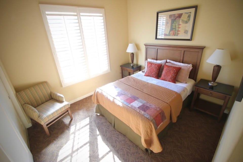 Queen Bedroom with double sliding door closets. Bathroom located across hall.