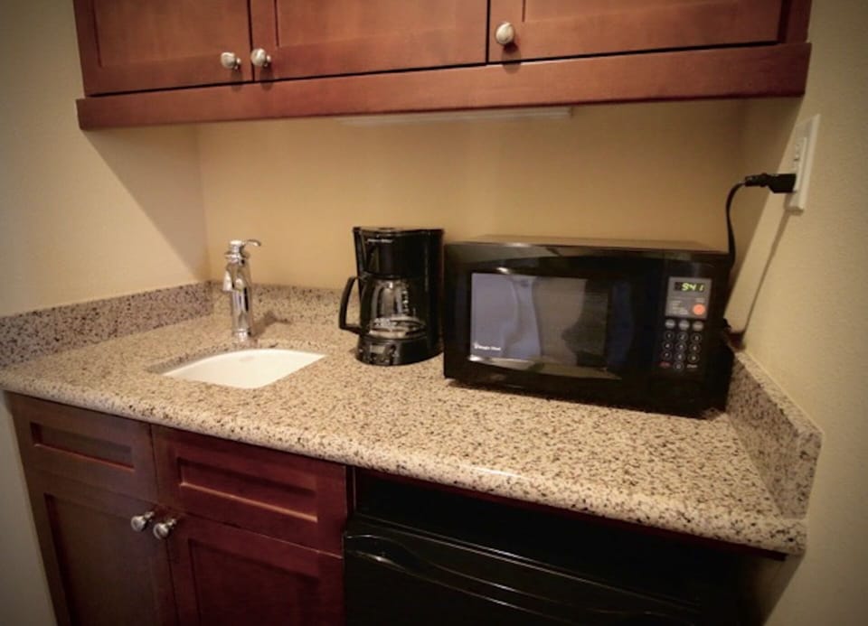 Personal microwave and coffeemaker inside King Suite. 