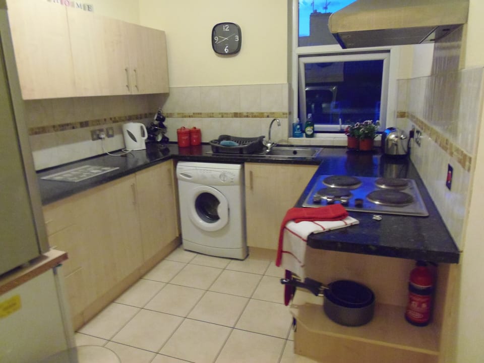 Shared Kitchen with washing machine and fridge and full crockery/cutlery/pans