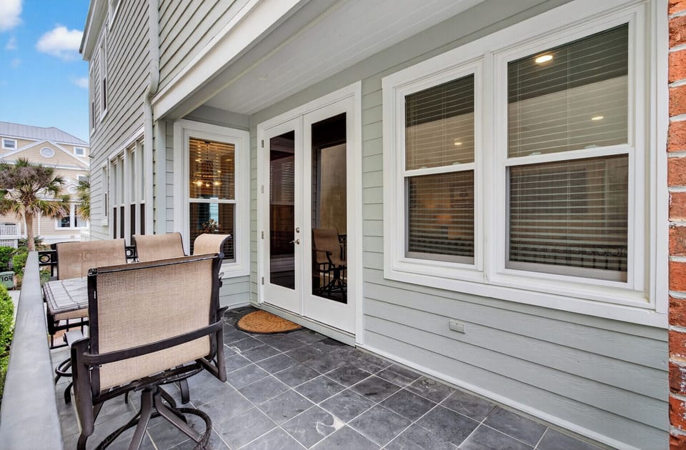 Unwind on your private balcony with comfortable seating, French doors opening to your bright interior.