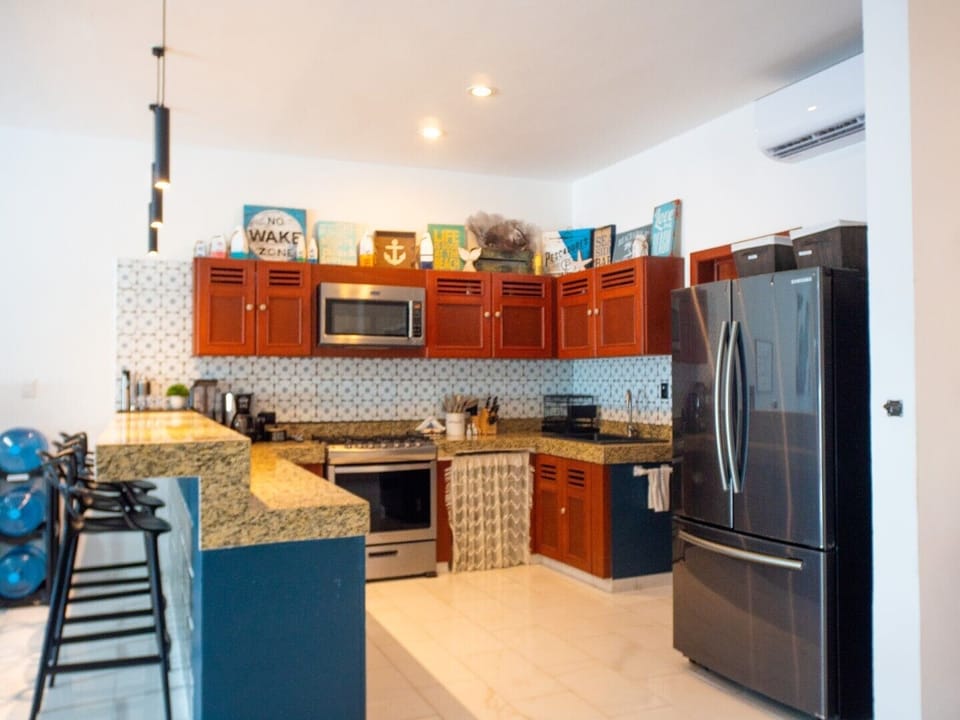 Large Kitchen equipped with Microwave, Gas Stove, Large Refrigerator 