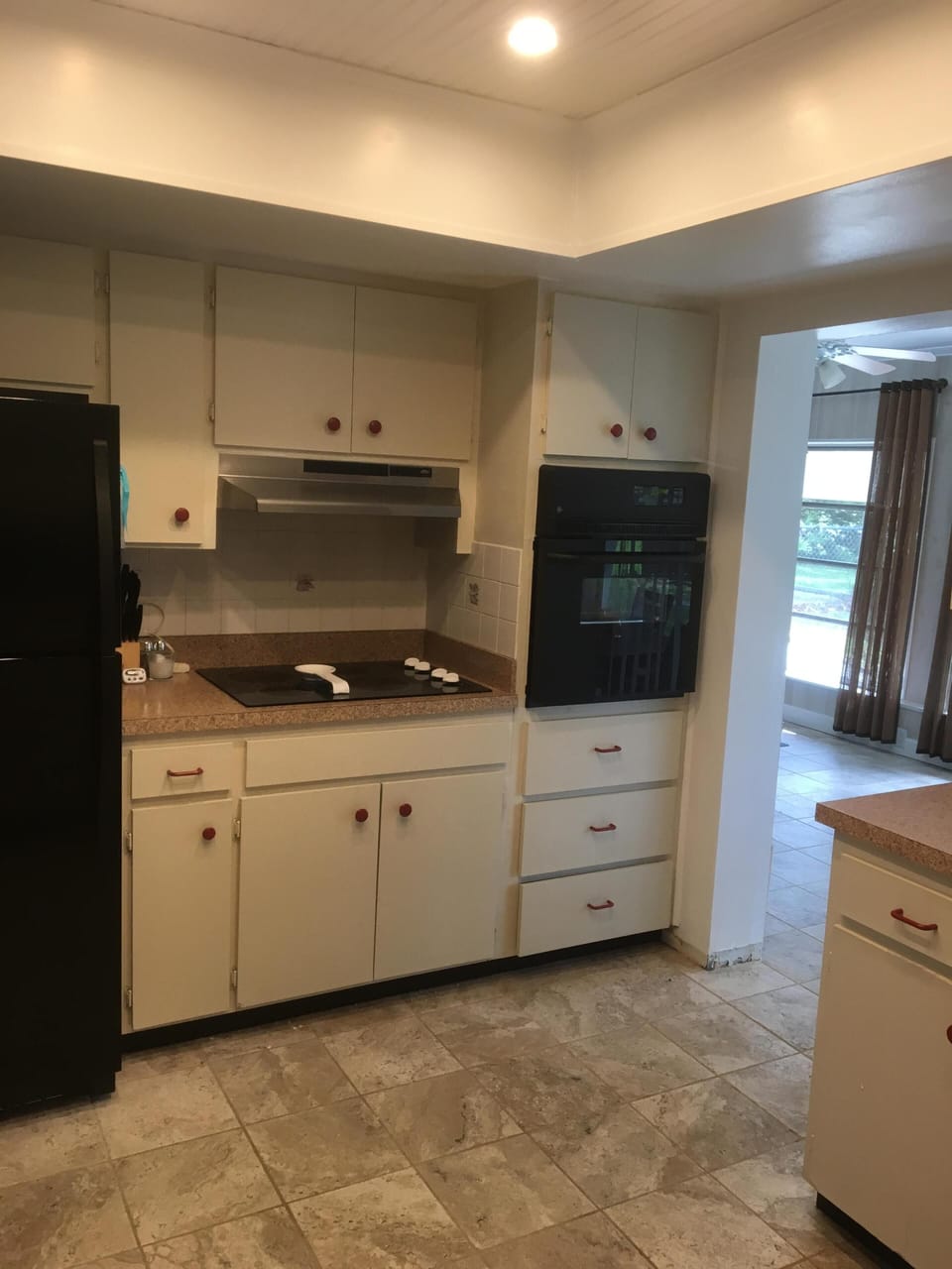 Kitchen comes equipped with a cook top, fridge, microwave and oven. 