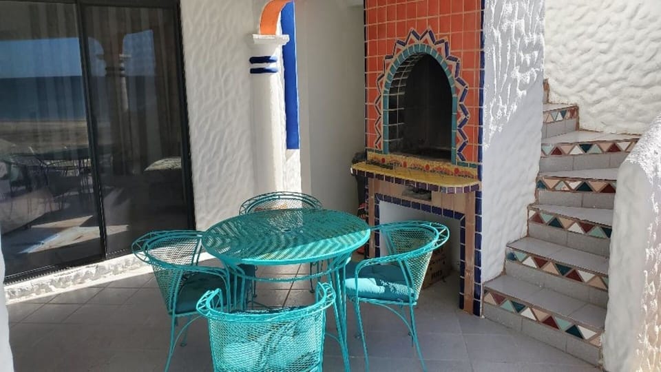 Charcoal grill/fireplace. Stairs to margarita Deck. BYOB charcoal & start fluid