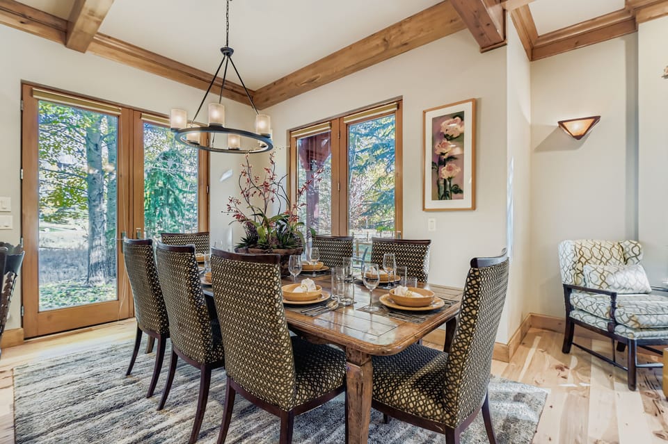 Dine in style! This home features a gourmet kitchen with granite counters & stainless appliances, and a spacious dining area with a large wooden table for all your family gatherings.