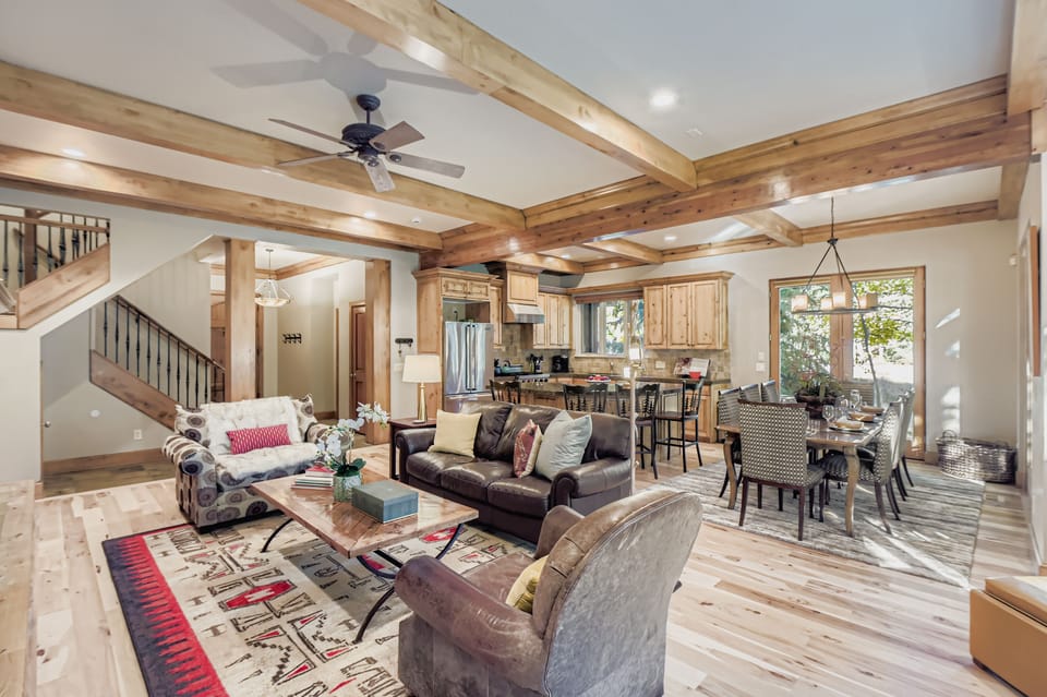 Sink into rich leather seating beneath stunning exposed beams in this warm living space that flows into your fully equipped kitchen.