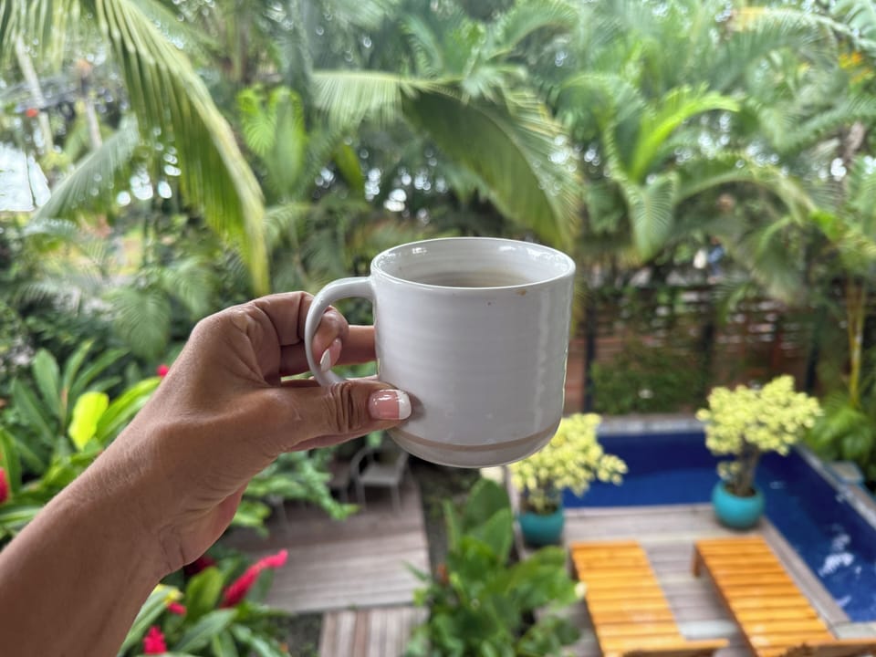Morning coffee surrounded by lush Caribbean jungle views.