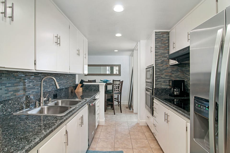 kitchen with closet washer and dryer and dinette for 4