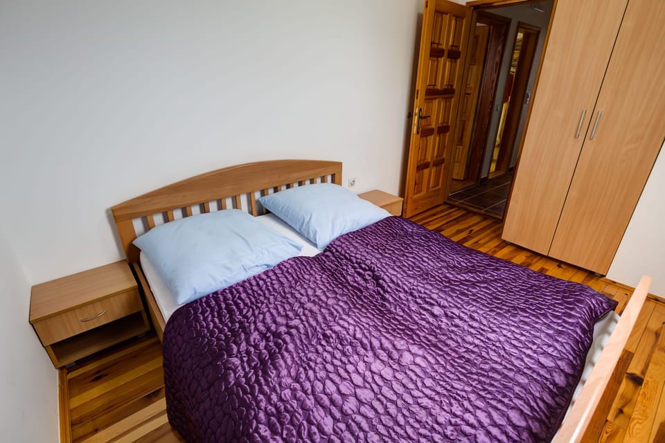 Double bed and wardrobe in bedroom 2.