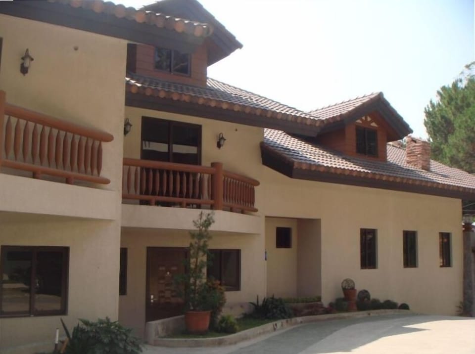 The townhouse as seen from the driveway. The garage is located behind the unit.