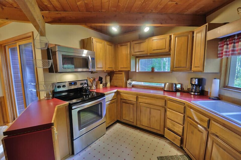 Kitchen with new stove and microwave.