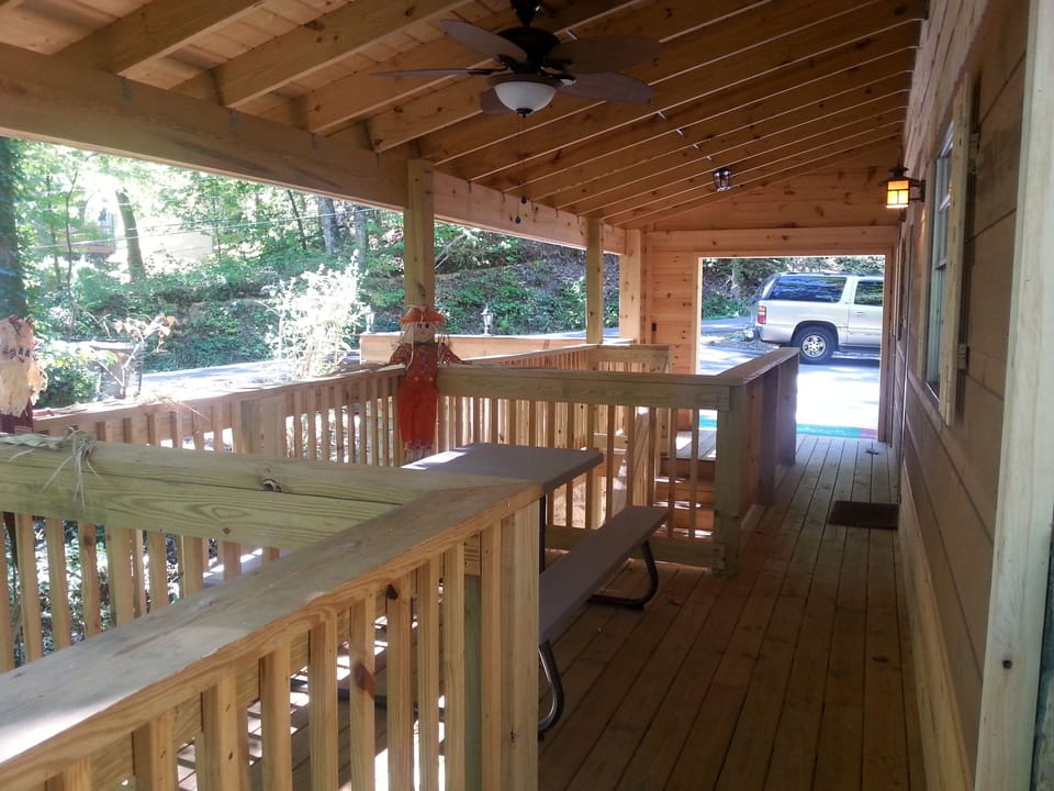 Huge covered porch with outdoor 8 person dining.