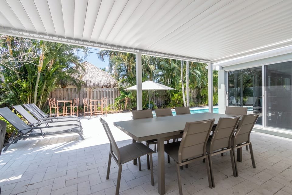 Outdoor Dining and Grill w/ adjustable shaded louvers (closed in photo)