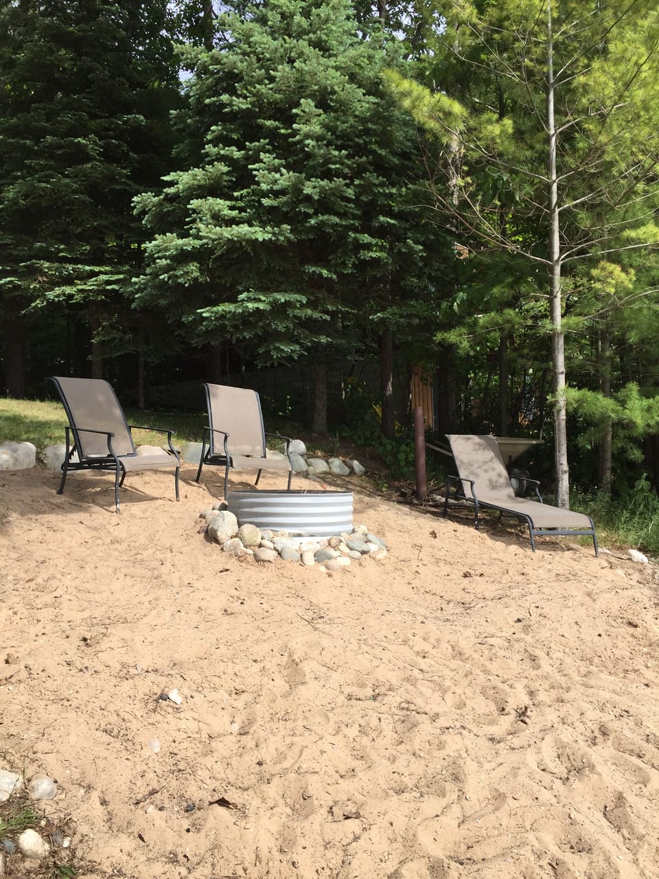Fire pit on the sandy beach.