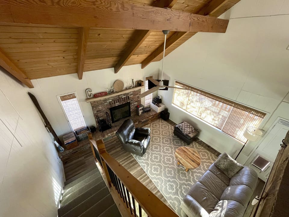 Top of Loft stairs looking down on living room.