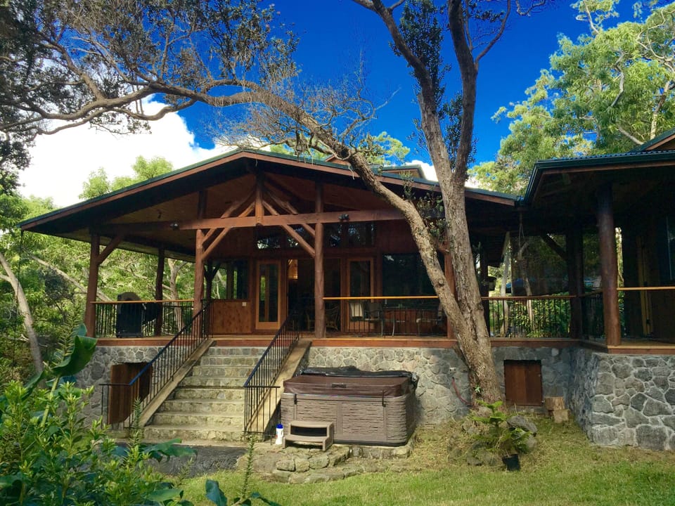 View from the private backyard looking at the front of the house with jacuzzi.